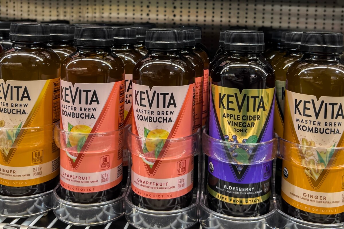 Bottles of commercial kombucha in a store. 