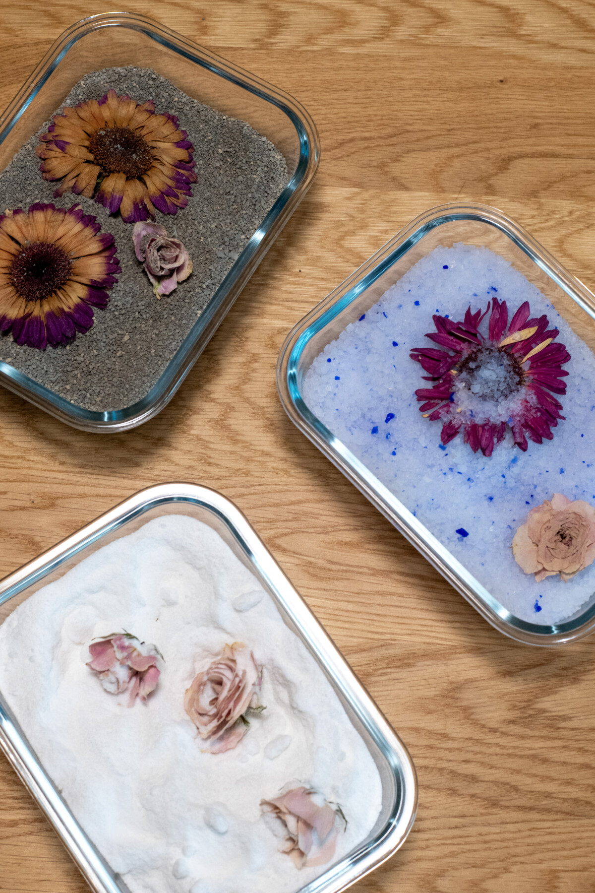 Pans of desiccants with flowers drying