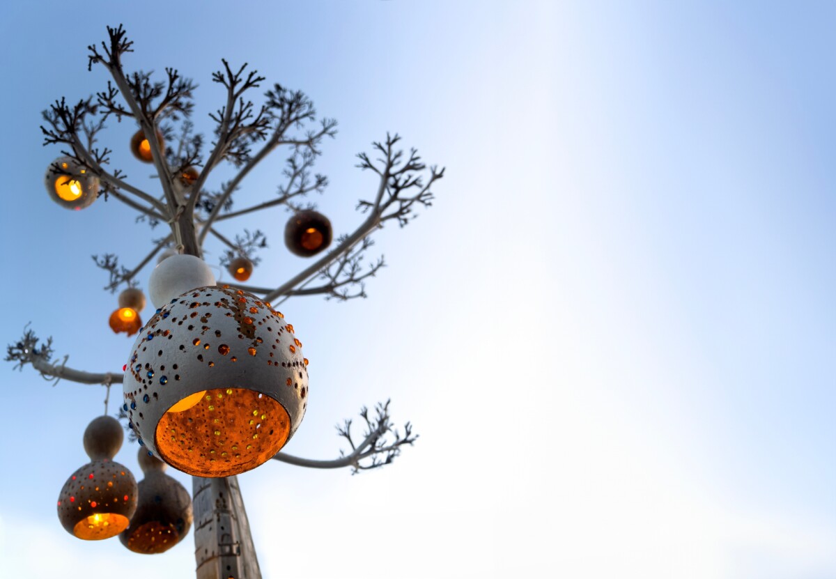 Tree with gourd lamps hanging in it