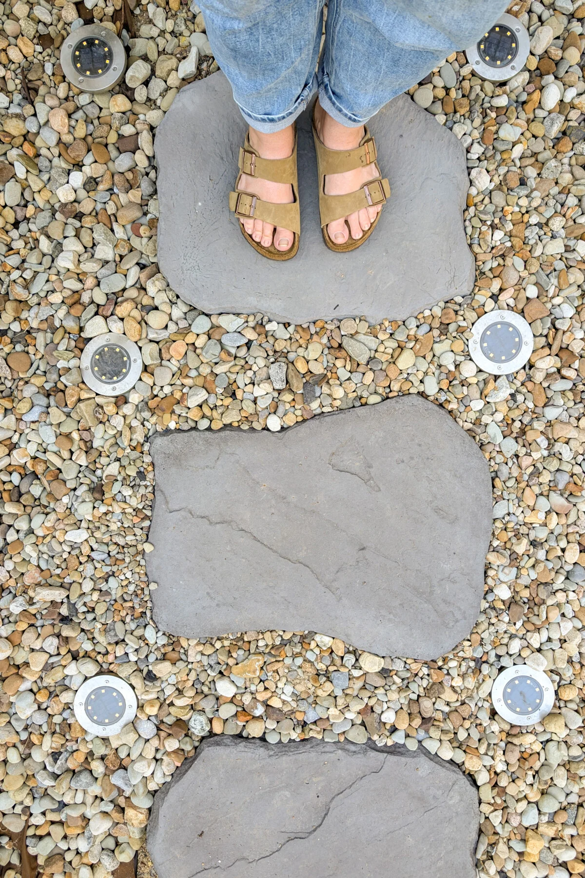 Stone pathway surrounded by decorative gravel