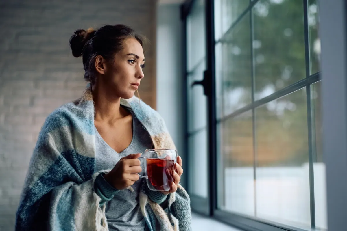 Woman looking out window