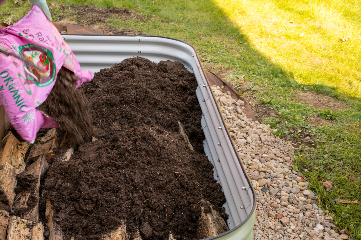 Adding soil to a raised bed