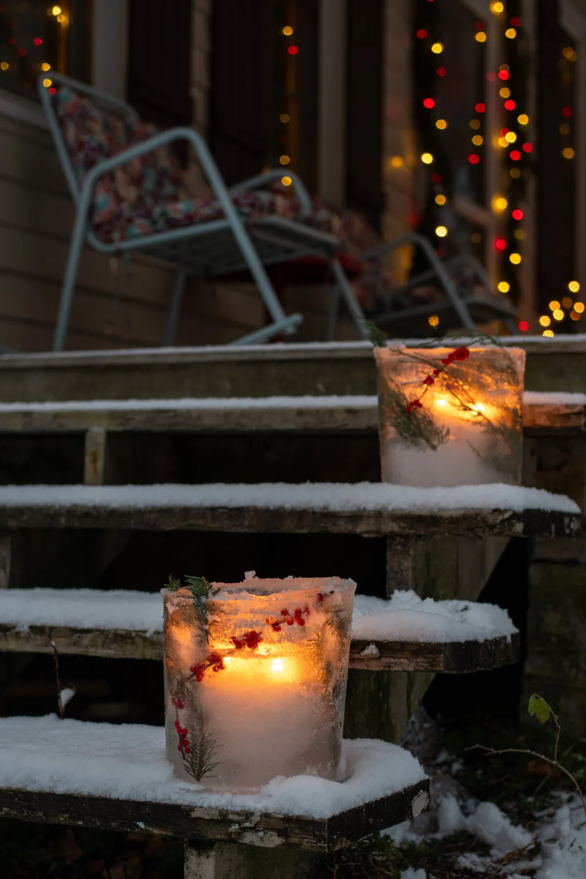 Luminaries made from ice on the steps of a porch