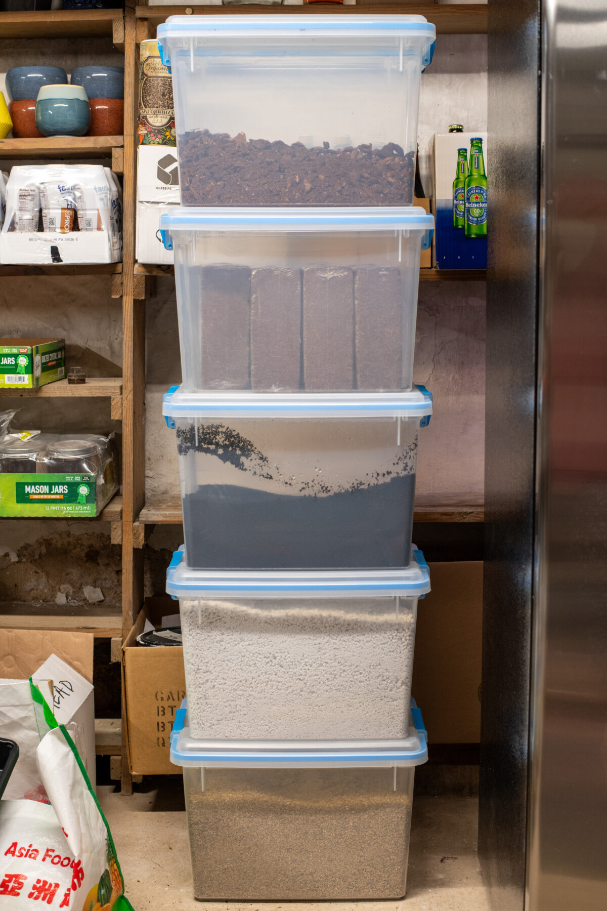 Storage totes filled with coconut coir, worm castings, perlite, fir bark and vermiculite